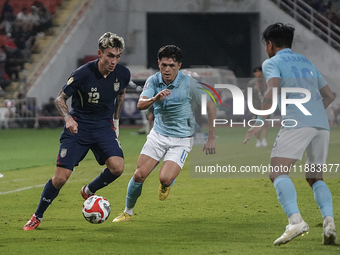 Nicholas Mickelson of Thailand plays against Nick Taylor of Cambodia during the Mitsubishi Electric Cup 2004 Group A match between Thailand...