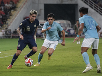 Nicholas Mickelson of Thailand plays against Nick Taylor of Cambodia during the Mitsubishi Electric Cup 2004 Group A match between Thailand...