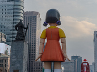 Behind Young-hee, a robotic doll from Netflix's ''Squid Game,'' stands at Gwanghwamun Square in Seoul, South Korea, on December 20, 2024. ''...