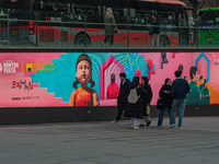 People walk past a displayed billboard for Netflix's ''Squid Game'' new season in Seoul, South Korea, on December 20, 2024. ''Squid Game'' s...