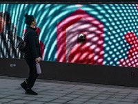 A person walks past a displayed billboard for Netflix's ''Squid Game'' new season in Seoul, South Korea, on December 20, 2024. ''Squid Game'...