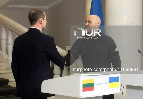 Prime Minister of Ukraine Denys Shmyhal shakes hands with Prime Minister of the Republic of Lithuania Gintautas Paluckas during a joint news...