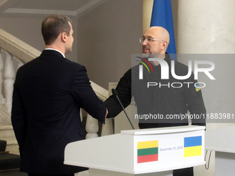 Prime Minister of Ukraine Denys Shmyhal shakes hands with Prime Minister of the Republic of Lithuania Gintautas Paluckas during a joint news...