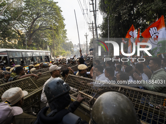 Indian Youth Congress supporters stage a protest against the state government over the death of a party worker in Guwahati, India, on Decemb...