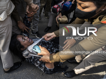 Police detain Indian Youth Congress supporters during a protest against the state government over the death of a party worker in Guwahati, I...