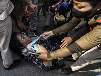 Police detain Indian Youth Congress supporters during a protest against the state government over the death of a party worker in Guwahati, I...