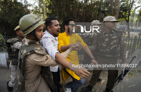 Police detain Indian Youth Congress supporters during a protest against the state government over the death of a party worker in Guwahati, I...