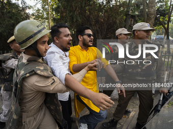 Police detain Indian Youth Congress supporters during a protest against the state government over the death of a party worker in Guwahati, I...