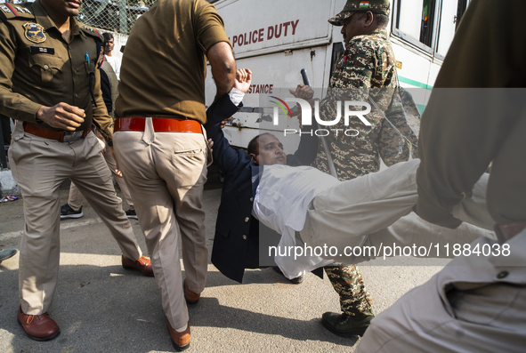 Police detain Indian Youth Congress supporters during a protest against the state government over the death of a party worker in Guwahati, I...