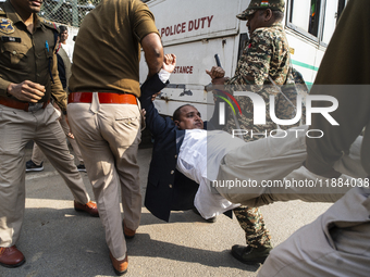 Police detain Indian Youth Congress supporters during a protest against the state government over the death of a party worker in Guwahati, I...