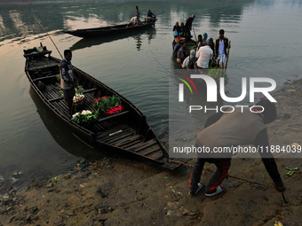 Local vegetable cultivators bring their vegetables to the local wholesale vegetable market after transporting them on a boat in the Tooker B...