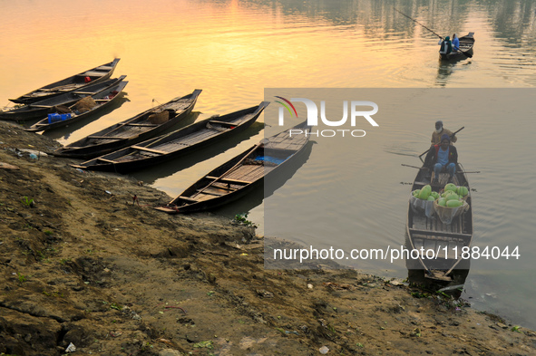 Local vegetable cultivators bring their vegetables to the local wholesale vegetable market after transporting them on a boat in the Tooker B...