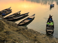 Local vegetable cultivators bring their vegetables to the local wholesale vegetable market after transporting them on a boat in the Tooker B...