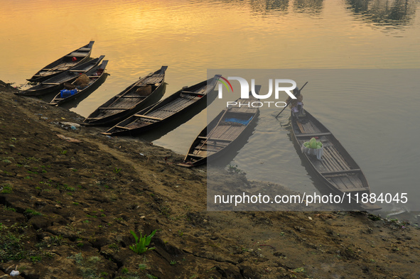 Local vegetable cultivators bring their vegetables to the local wholesale vegetable market after transporting them on a boat in the Tooker B...