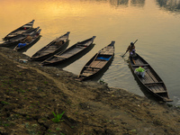 Local vegetable cultivators bring their vegetables to the local wholesale vegetable market after transporting them on a boat in the Tooker B...