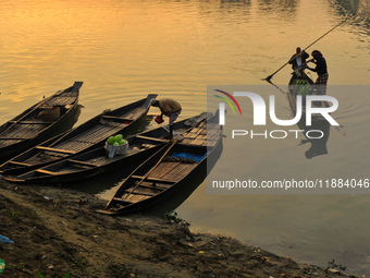 Local vegetable cultivators bring their vegetables to the local wholesale vegetable market after transporting them on a boat in the Tooker B...