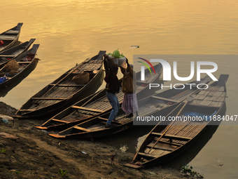 Local vegetable cultivators bring their vegetables to the local wholesale vegetable market after transporting them on a boat in the Tooker B...