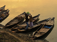 Local vegetable cultivators bring their vegetables to the local wholesale vegetable market after transporting them on a boat in the Tooker B...