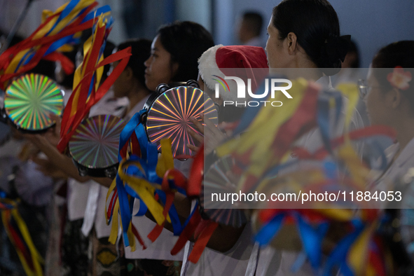 The choir group of the William Booth Christian College Jakarta performs during the Christmas Carol to celebrate the upcoming Christmas in Ja...