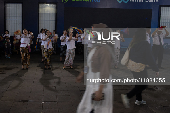 The choir group of the William Booth Christian College Jakarta performs during the Christmas Carol to celebrate the upcoming Christmas in Ja...