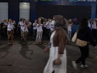 The choir group of the William Booth Christian College Jakarta performs during the Christmas Carol to celebrate the upcoming Christmas in Ja...