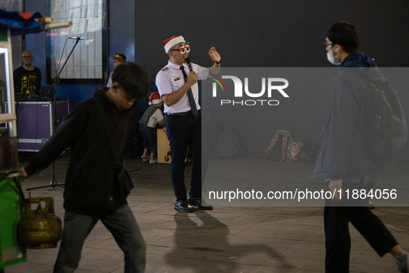 The choir group of the William Booth Christian College Jakarta performs during the Christmas Carol to celebrate the upcoming Christmas in Ja...