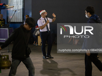 The choir group of the William Booth Christian College Jakarta performs during the Christmas Carol to celebrate the upcoming Christmas in Ja...