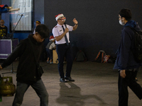 The choir group of the William Booth Christian College Jakarta performs during the Christmas Carol to celebrate the upcoming Christmas in Ja...