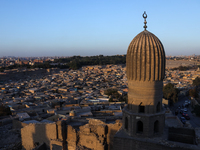 The sun sets in Old Cairo, Egypt, on December 20, 2024. (