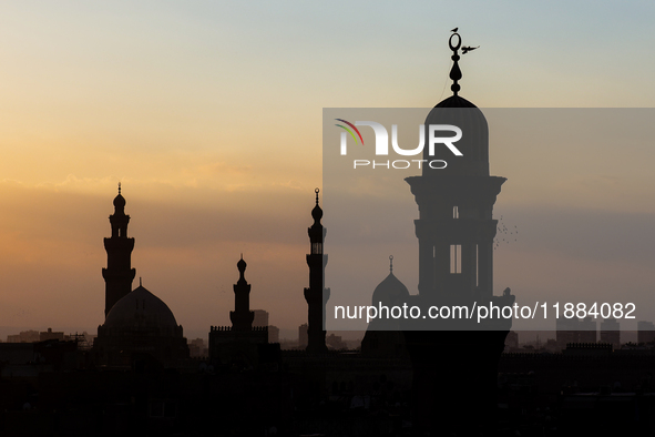 The sun sets in Old Cairo, Egypt, on December 20, 2024. (