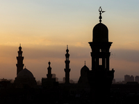 The sun sets in Old Cairo, Egypt, on December 20, 2024. (