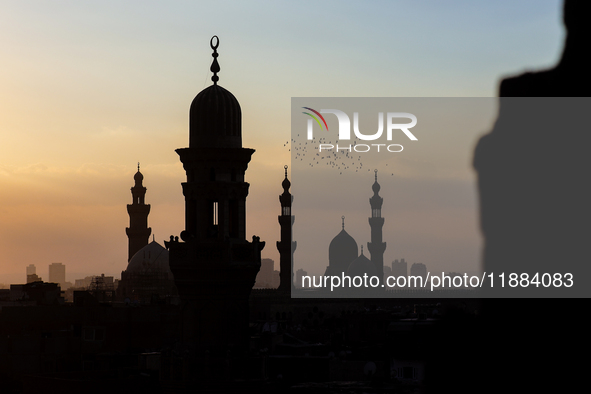 The sun sets in Old Cairo, Egypt, on December 20, 2024. (