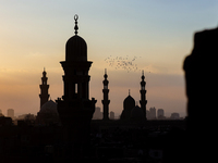 The sun sets in Old Cairo, Egypt, on December 20, 2024. (