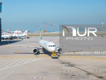 An Airbus A321 of Eva Airways pushes back from the gate at the Hong Kong International Airport in Hong Kong, China, on December 1, 2024. (