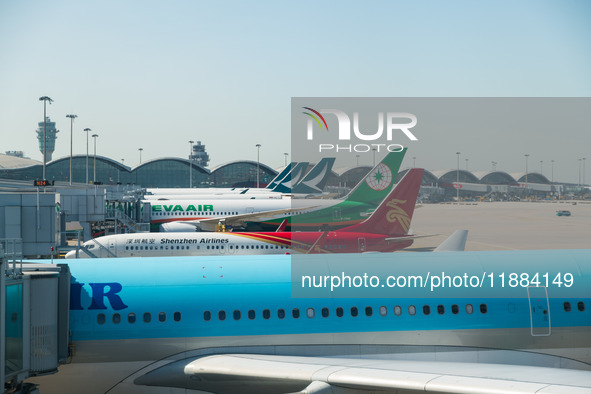 Planes park at the gate in the Hong Kong International Airport in Hong Kong, China, on December 1, 2024. 