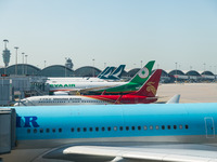 Planes park at the gate in the Hong Kong International Airport in Hong Kong, China, on December 1, 2024. (