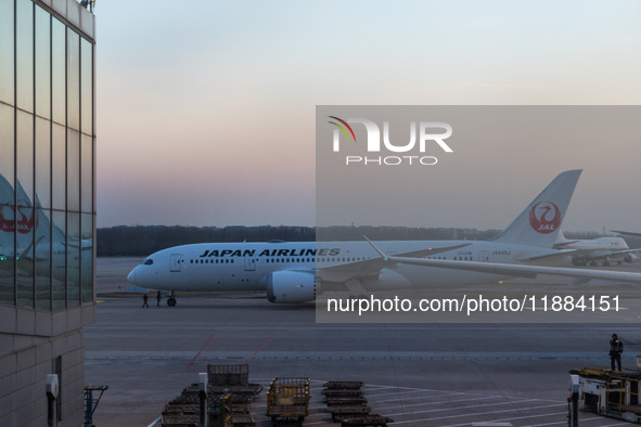 A Boeing 787-8 Dreamliner of Japan Airlines gets ready for takeoff at the Beijing Capital International Airport in Beijing, China, on Decemb...