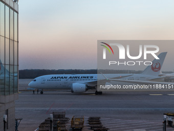 A Boeing 787-8 Dreamliner of Japan Airlines gets ready for takeoff at the Beijing Capital International Airport in Beijing, China, on Decemb...