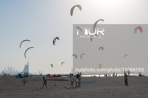 In Dubai, United Arab Emirates, kite surfers fill the sky with kites on a beach in Jumeirah. 