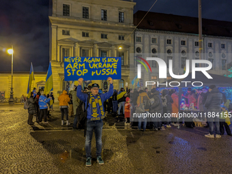 A demonstration takes place at Odeonsplatz in Munich, Germany, on December 20, 2024, in support of the people in Ukraine. The participants d...