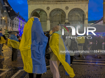 A demonstration takes place at Odeonsplatz in Munich, Germany, on December 20, 2024, in support of the people in Ukraine. The participants d...