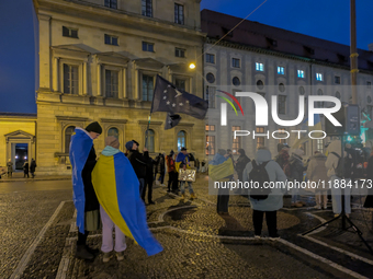 A demonstration takes place at Odeonsplatz in Munich, Germany, on December 20, 2024, in support of the people in Ukraine. The participants d...