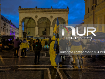 A demonstration takes place at Odeonsplatz in Munich, Germany, on December 20, 2024, in support of the people in Ukraine. The participants d...