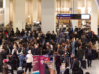 A general view of a crowd of travelers is seen at Duesseldorf Airport in Duesseldorf, Germany, on December 20, 2024, ahead of the Christmas...