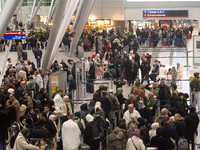 A general view of a crowd of travelers is seen at Duesseldorf Airport in Duesseldorf, Germany, on December 20, 2024, ahead of the Christmas...