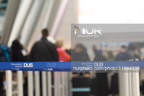 A general view of a crowd of travelers is seen at Duesseldorf Airport in Duesseldorf, Germany, on December 20, 2024, ahead of the Christmas...