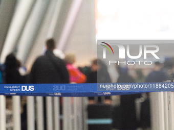 A general view of a crowd of travelers is seen at Duesseldorf Airport in Duesseldorf, Germany, on December 20, 2024, ahead of the Christmas...