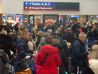 A general view of a crowd of travelers is seen at Duesseldorf Airport in Duesseldorf, Germany, on December 20, 2024, ahead of the Christmas...