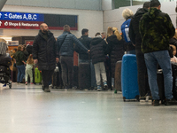 A general view of a crowd of travelers is seen at Duesseldorf Airport in Duesseldorf, Germany, on December 20, 2024, ahead of the Christmas...