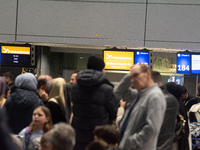 A general view of a crowd of travelers is seen at Duesseldorf Airport in Duesseldorf, Germany, on December 20, 2024, ahead of the Christmas...